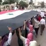 Proteste di piazza ad Hama (Afp) 
