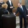 Silvio Berlusconi stringe la mano al procuratore aggiunto di Milano Ilda Boccassini (Ansa) 