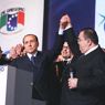 Nella foto Berlusconi alla convention "Italiani nel mondo" organizzata da Sergio De Gregorio (a destra) a Napoli nel 2008 (Olycom) 